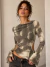 Blusa manga larga con aberturas y broches