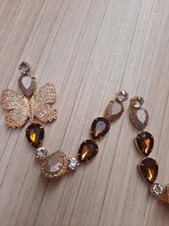 V BORBOLETA STRASS GLITER DOURADO FINO/MARROM na internet