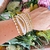 Mix de Pulseiras Dourada com Tons Marfim na internet