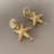 Brinco estrela dourada