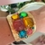 Bracelete acetinado vazado colorido na internet
