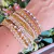 Mix de Pulseiras Dourada com Tons Marfim - comprar online