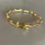 Bracelete Prego Dourado com Zircônia