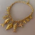 Colar Sereia Pingentes Peixes, Búzios e Estrelas Dourado