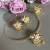 Anel Class Flor pérola com dourado - comprar online