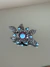 Broche flor grafite strass turquesa com pink na internet