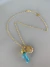 Colar resort pinguinho dourado resina alga azul e concha dourada - comprar online