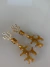 Brinco Maxibrinco resort dourado resina alga âmbar - comprar online