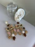 Brinco resort dourado resina tons variados - comprar online