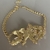 choker flor poa dourada