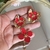 Conjunto Brinco e anel diferentes Orquídea vermelho com dourado na internet