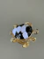 Broche dourado tartaruga preto e branco