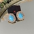 Brinco oval azul com strass