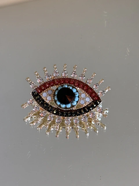 Broche dourado olho grego colorido