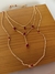 Colar cdourado com zircônia vermelha na internet