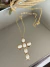 Colar Ray dourado Cruz com resina marfim cordão dourado fino 70 cm longo na internet