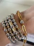 Mix de Pulseiras Duo prata com dourado com cinco pulseiras na internet
