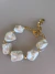 Pulseira dourada verniz italiano pérola Shell
