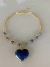 Colar dourado Jade pedras naturais quartzo azul lateral aro dourado - comprar online