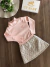 Conjunto Infantil Blusa Rosa em Ribana Canelada com Gola e Short Saia em Matelassê Brilhoso Up Baby 120745771 - comprar online