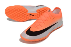 Chuteira society Nike Mercurial Vapor 17 Elite na cor laranja com detalhes em preto e solado laranja