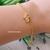 Pulseira Pingente de Pezinho Cravejado de Zircônias Banhada a Ouro 18k - comprar online
