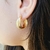 Brinco de Argola Detalhes Ondulados Banhado a Ouro 18k e Prata - loja online