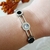 Bracelete Três Pontos Pretos e Zircônia Banhado a Prata - comprar online