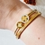 Bracelete Dois Trevos Cravejados de Zircônias Banhado a Ouro 18k na internet