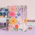 CUADERNO FLORES FONDO ROSA A5 RAYADO