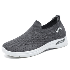 Tênis ortopédico masculino Comfort Sneakers® na cor cinza, com design moderno e solado branco.