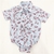 Body camisa celeste hojas rojas