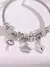 Pulseira com berloque banhada a prata