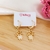 Brinco de Filhos com 2 Meninas com Zircônias Banhados a Ouro 18k
