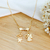 Colar de Filhos 1 Menino e 1 Anjo com Zircônias Banhados a Ouro 18k - comprar online