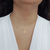 COLAR COM PINGENTE DE ANJO COM ZIRCÔNIAS COR DE ROSA BANHADO A OURO 18K na internet