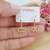 Brinco de argolinha com Lacinho e detalhe de zircônias Banhado a Ouro 18k - comprar online