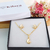 CONJUNTO INFANTIL DE COLAR E BRINCOS DE ESTRELAS COM ZIRCÔNIAS BANHADO A OURO 18K