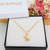 COLAR COM PINGENTE DE ANJO COM ZIRCÔNIAS AZUIS BANHADO A OURO 18K - comprar online