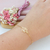 PULSEIRA FLOR DE LOTUS VAZADA BANHADA A OURO 18K