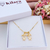 COLAR DE FILHOS 2 MENINOS COM ZIRCÔNIAS BANHADOS A OURO 18K - comprar online