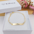 PULSEIRA INFANTIL CHAPINHA COM PÉROLAS PERSONALIZADA BANHADA A OURO 18K