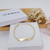 PULSEIRA INFANTIL DE CHAPINHA COM NOME PERSONALIZADA BANHADA A OURO 18K
