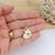 COLAR MEDALHA DE CORAÇÃO GRANDE COM LETRA INICIAL VAZADA BANHADO A OURO 18K - comprar online