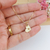 COLAR MEDALHA DE CORAÇÃO PEQUENA COM LETRA INICIAL VAZADA BANHADO A OURO 18K - comprar online