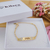PULSEIRA INFANTIL CHAPINHA CORAÇÕES PERSONALIZADA COM NOME BANHADA A OURO 18K - comprar online