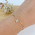 PULSEIRA ELOS CARTIE PINGENTE DE CORAÇÃO COM ZIRCÔNIAS BANHADA A OURO 18K - comprar online