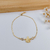 PULSEIRA DE NOSSA SENHORA APARECIDA COM ZIRCÔNIAS BANHADA A OURO 18K - comprar online