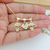 COLAR DE FILHOS 2 MENINOS CRAVEJADOS DE FILHOS E CORAÇÃO COM NOMES GRAVADOS BANHADOS A OURO 18K