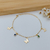PULSEIRA DE BORBOLETAS COM PEDRAS COLORIDAS BANHADA A OURO 18K - comprar online